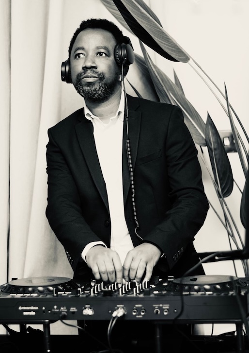DJ Femzo performing at the decks